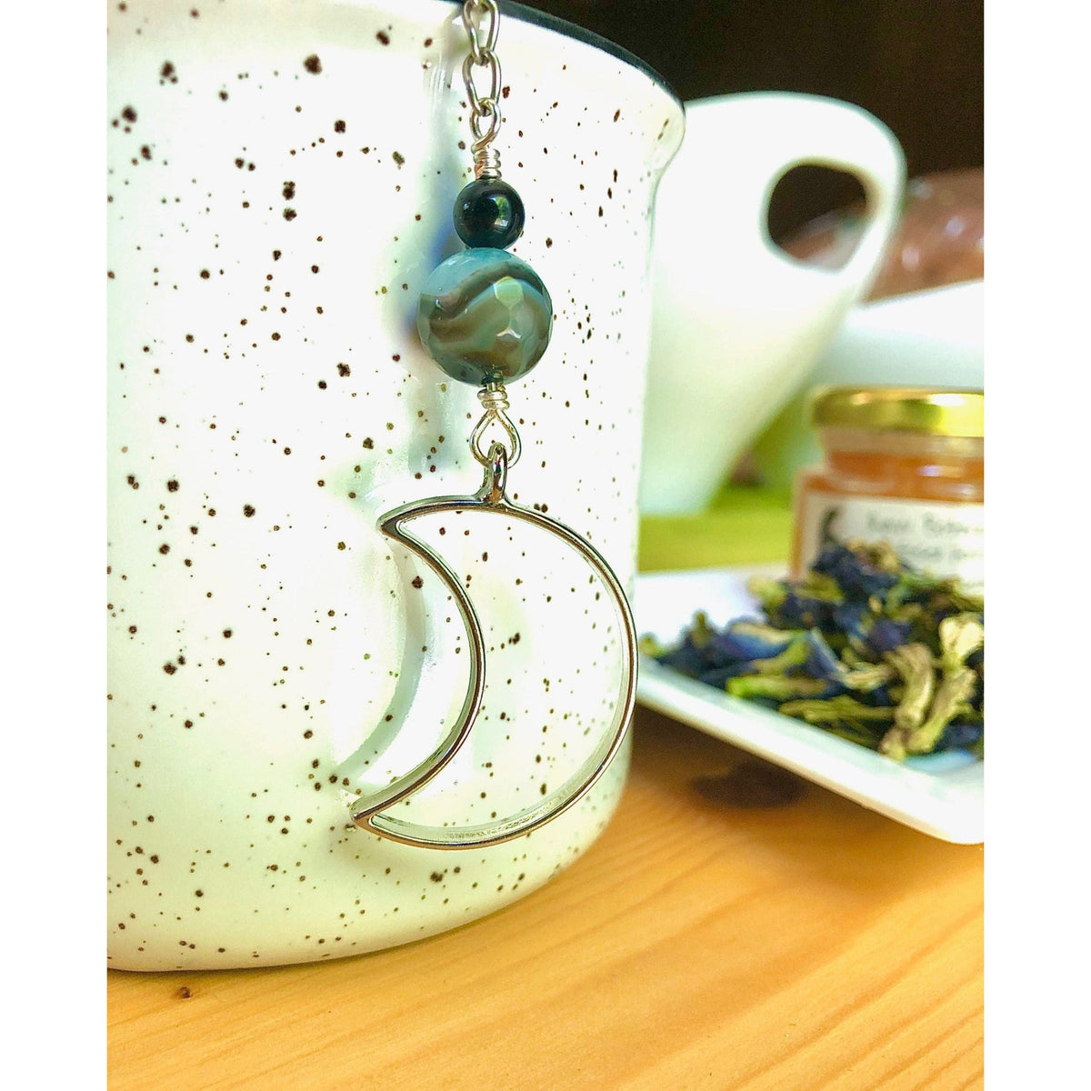 Goodnight Moon Charmed Tea Infuser – Silver Crescent Moon with Black and Blue Banded Agate Bead by Kinley Jewelry
