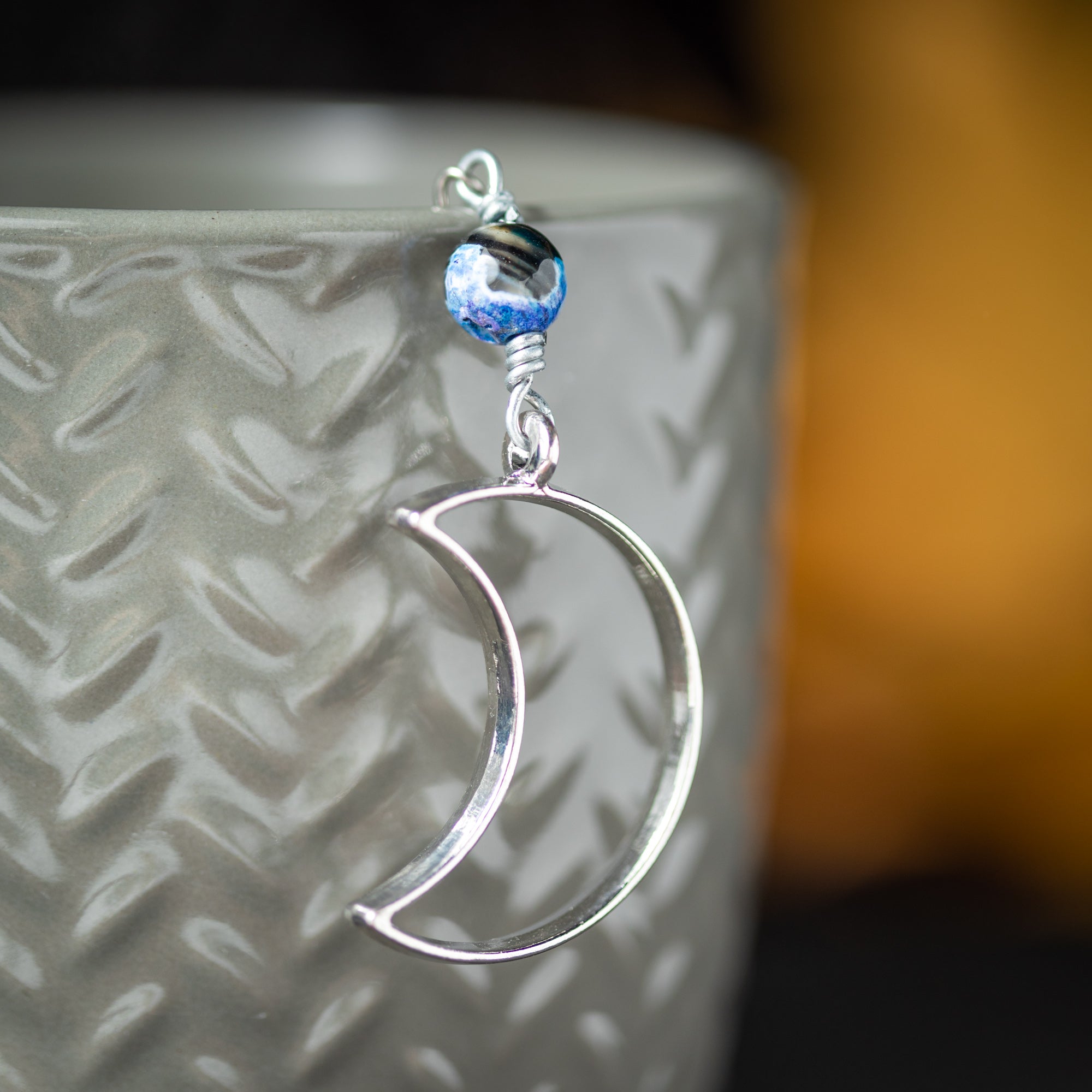 Goodnight Moon Charmed Tea Infuser – Silver Crescent Moon with Black and Blue Banded Agate Bead by Kinley Jewelry