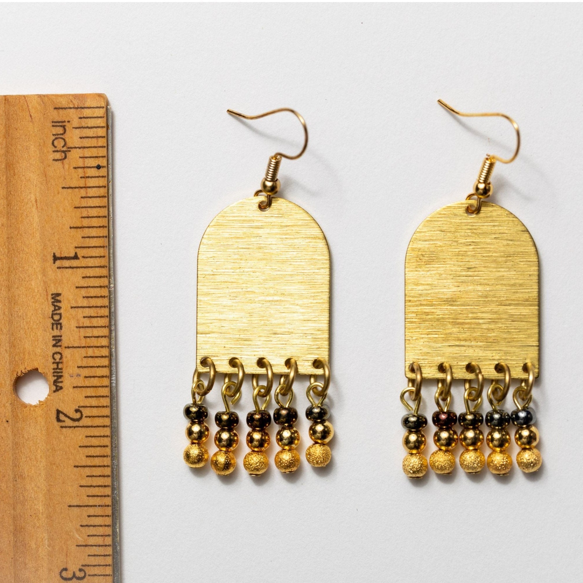 Shimmering Gold Arches with Bead Fringe