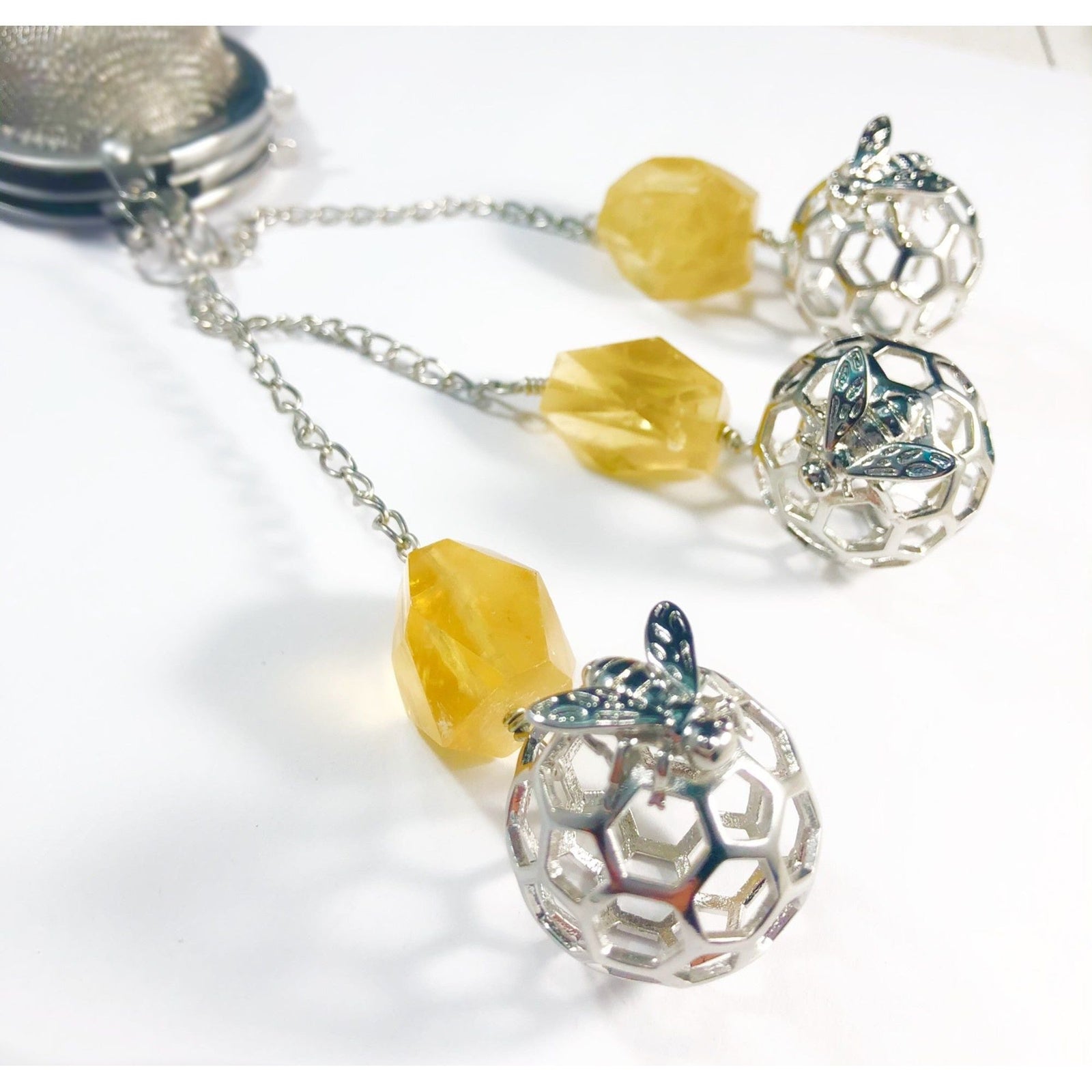 Honey Bee Charmed Tea Infuser with Honey Calcite Stone – Silver Honeycomb and Bee Charm with Honey Calcite by Kinley Jewelry