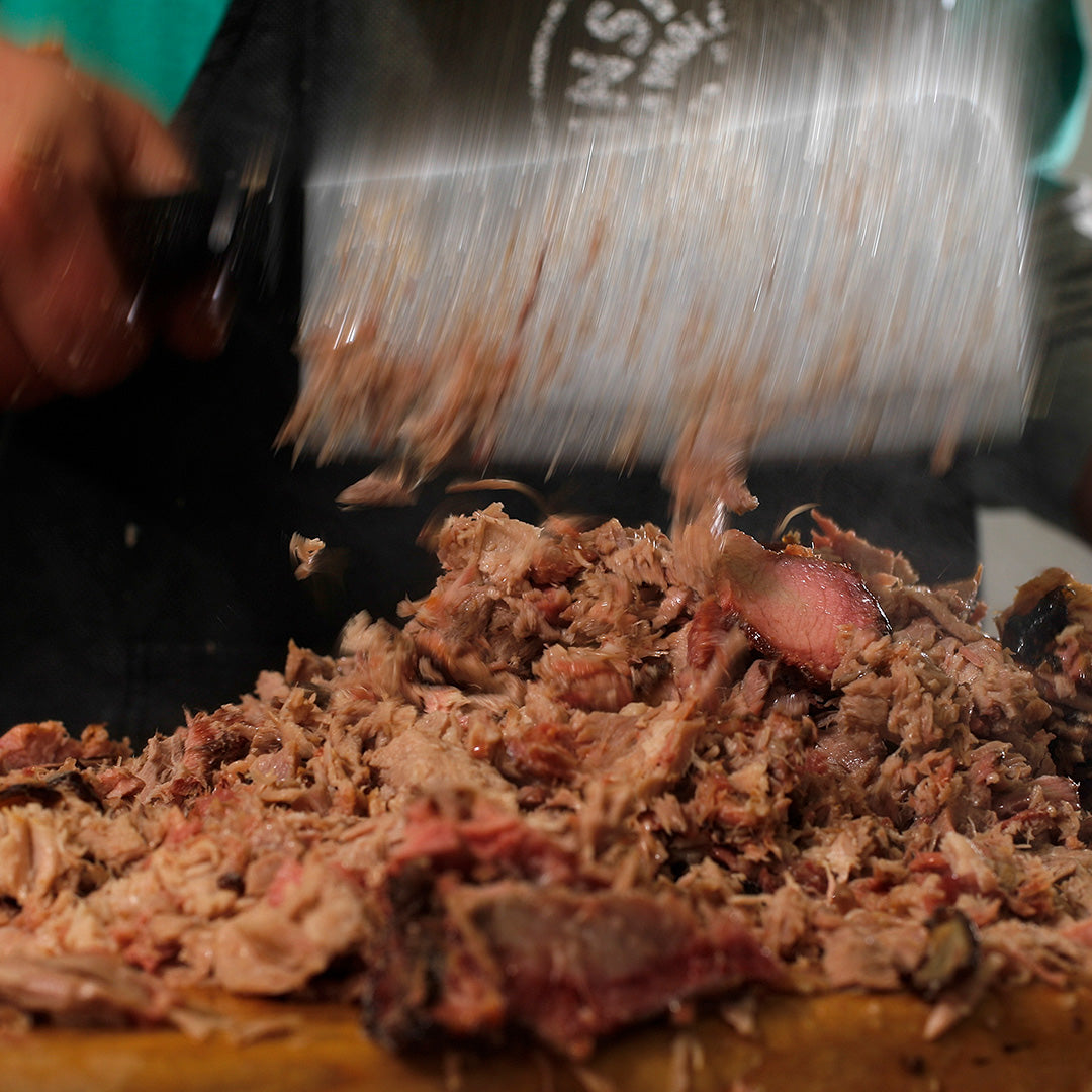 2 lbs of our Famous Pulled Pork + BBQ Sauce & Magic Dust